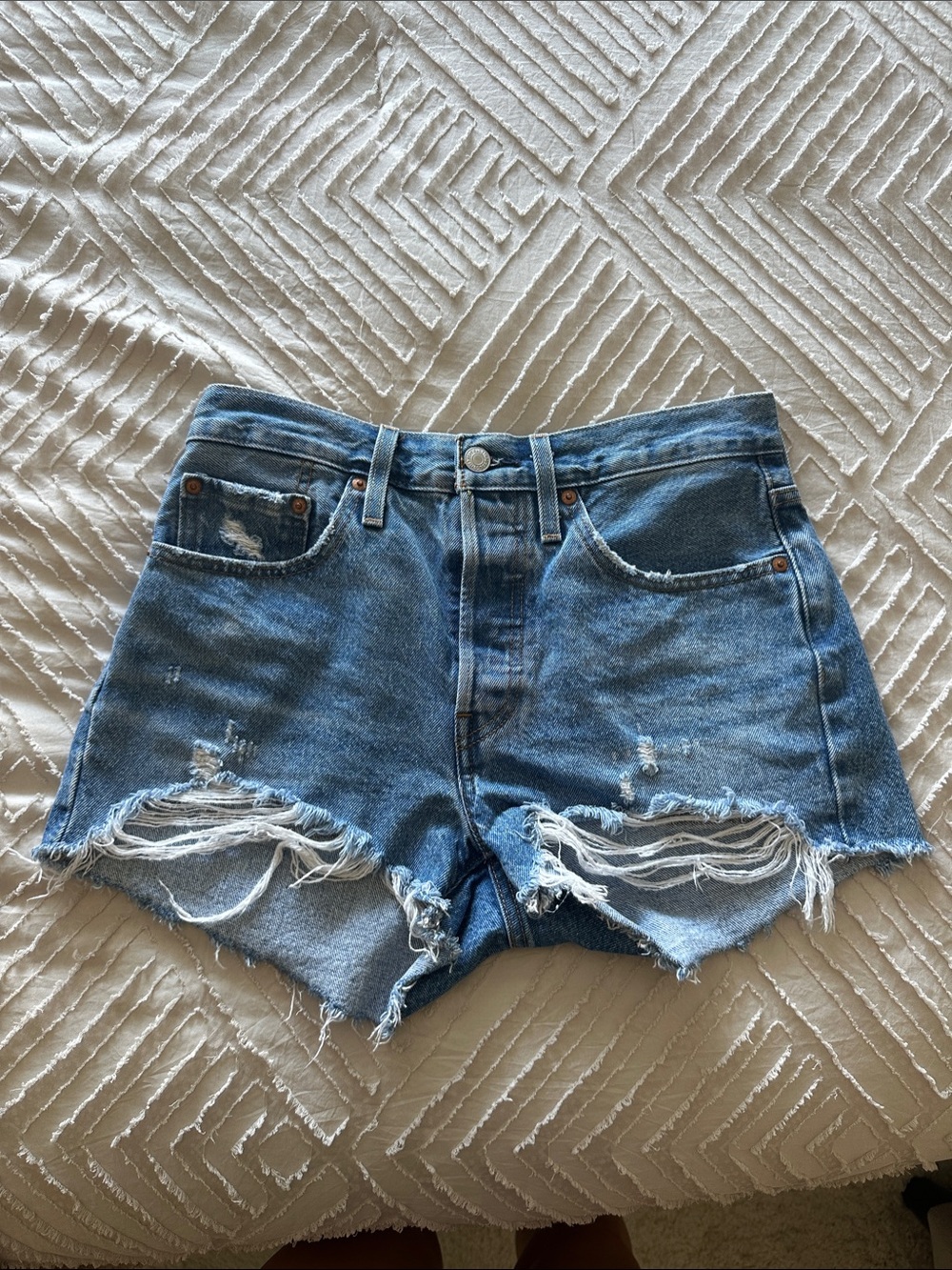 High-Rise Distressed Denim Cutoff Shorts in Blue